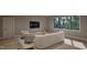 A cozy living room with modern furnishings, a view and neutral tones at 4308 Windsor Pl, Raleigh, NC 27609