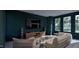 Entertainment room with unique seating, a large TV, and forest views at 4308 Windsor Pl, Raleigh, NC 27609