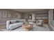 Living room with neutral furniture, artwork, and a wet bar at 4308 Windsor Pl, Raleigh, NC 27609