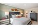 Spacious bedroom with a comfortable bed, wooden accents, and coordinating decor at 434 Belgian Red Way, Wake Forest, NC 27587