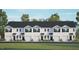 Charming new construction townhomes boasting attached garages, manicured lawns, and timeless curb appeal at 434 Belgian Red Way, Wake Forest, NC 27587