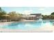 Inviting community pool with lounge chairs, umbrellas, and a nearby covered pavilion at 434 Belgian Red Way, Wake Forest, NC 27587