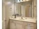 Bathroom features a single sink vanity, drawers, and a large mirror at 5008 Casland Dr, Raleigh, NC 27604