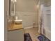 Bright bathroom features a vessel sink, wood countertop, and tile floors at 5008 Casland Dr, Raleigh, NC 27604
