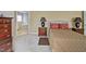 Well-lit bedroom showcasing a bed with decorative pillows and an adjacent ensuite bathroom for convenience at 5008 Casland Dr, Raleigh, NC 27604