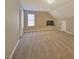 Large bonus room with neutral walls, carpet, and a window at 5008 Casland Dr, Raleigh, NC 27604