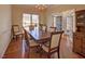 The dining room features hardwood floors and a bright chandelier at 5008 Casland Dr, Raleigh, NC 27604
