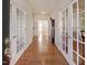 Inviting foyer with gleaming hardwood floors and elegant French doors at 5008 Casland Dr, Raleigh, NC 27604