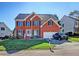 Beautiful brick home with manicured lawn, two-car garage, and a charming front entrance at 5008 Casland Dr, Raleigh, NC 27604