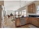 Open floor plan with a kitchen flowing into the living area, featuring sleek countertops and ample cabinet space at 5008 Casland Dr, Raleigh, NC 27604