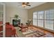 Well-lit living room featuring a fireplace, hardwood floors, and a comfortable seating area at 5008 Casland Dr, Raleigh, NC 27604