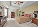 Spacious main bedroom boasts a tray ceiling, plush carpet, and an ensuite bathroom, creating a private retreat at 5008 Casland Dr, Raleigh, NC 27604