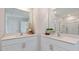 Modern bathroom with dual sinks, quartz countertops, and a glass-enclosed shower at 515 Old Battle Bridge Rd, Wendell, NC 27591