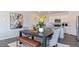 Charming dining area with adjacent modern kitchen featuring an island with granite countertop at 515 Old Battle Bridge Rd, Wendell, NC 27591