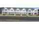 Charming row of new townhomes with manicured lawns and neutral exteriors at 515 Old Battle Bridge Rd, Wendell, NC 27591