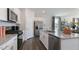 Modern kitchen showcases stainless steel appliances, a granite island, and an open-concept design at 515 Old Battle Bridge Rd, Wendell, NC 27591