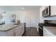 Contemporary kitchen featuring white cabinets, stainless steel appliances, and a granite island at 515 Old Battle Bridge Rd, Wendell, NC 27591