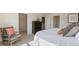 Comfortable main bedroom includes a walk-in closet, chair and dresser at 515 Old Battle Bridge Rd, Wendell, NC 27591