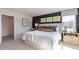 Serene main bedroom with an ensuite bathroom, ample natural light, and a modern aesthetic at 515 Old Battle Bridge Rd, Wendell, NC 27591