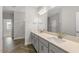 Bright bathroom featuring double sinks, quartz countertops, and luxury fixtures at 528 Lemon Daisy Ln, Knightdale, NC 27545
