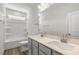 Bright bathroom featuring double sinks, quartz countertops, and bathtub-shower at 528 Lemon Daisy Ln, Knightdale, NC 27545