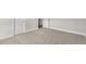 Spacious bedroom with neutral carpet and ample natural light from large windows at 528 Lemon Daisy Ln, Knightdale, NC 27545