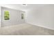 Bright bedroom with carpet, neutral walls, and a tranquil view from the windows at 528 Lemon Daisy Ln, Knightdale, NC 27545