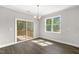 Charming dining room with sliding doors to a covered deck and a scenic backyard view at 528 Lemon Daisy Ln, Knightdale, NC 27545
