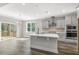 Kitchen featuring a center island, stainless appliances, and an eat-in area with a sliding door to the screened porch at 528 Lemon Daisy Ln, Knightdale, NC 27545