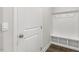 Convenient mud room with a built-in bench, coat hooks, and cubbies for storage at 528 Lemon Daisy Ln, Knightdale, NC 27545