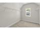 Spacious walk-in closet with shelving and natural light from a large window at 528 Lemon Daisy Ln, Knightdale, NC 27545