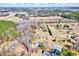 Community aerial view of residences, mature trees, roads, and pond, showcasing the area's natural beauty at 57 Lowell Ct, Smithfield, NC 27577