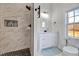 Bathroom featuring tiled shower, modern vanity, and updated fixtures at 57 Lowell Ct, Smithfield, NC 27577