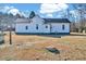 The home features classic white siding and multiple windows, complemented by an expanse of green lawn at 57 Lowell Ct, Smithfield, NC 27577