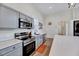 Well-equipped kitchen with stainless steel appliances, gray cabinets, and ample counter space at 57 Lowell Ct, Smithfield, NC 27577