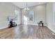 Bright living room with hardwood floors, vaulted ceilings, and large windows at 57 Lowell Ct, Smithfield, NC 27577