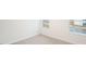 Cozy bedroom featuring neutral carpeting, white trim, and two windows for natural light at 6024 Sodium St, Raleigh, NC 27610
