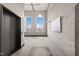Well-lit hallway with elevator access and large windows, showing carpeted floors and updated interior design at 614 Capital Blvd # 229, Raleigh, NC 27603