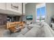 Cozy living room with exposed brick accents, modern décor, large windows, and a comfortable sofa at 614 Capital Blvd # 229, Raleigh, NC 27603