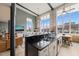 Open concept living space with kitchen, dining, and living areas, featuring exposed brick and beam accents at 614 Capital Blvd # 229, Raleigh, NC 27603