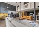 Open living space with modern kitchen, exposed beams, tall ceilings and a mix of textures at 614 Capital Blvd # 229, Raleigh, NC 27603