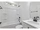 Bright bathroom with black hardware and a bathtub/shower combination at 704 East St, Smithfield, NC 27577