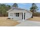 Charming home featuring a well-maintained yard and modern architectural details at 704 East St, Smithfield, NC 27577