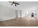 Spacious living room with modern flooring flowing into an open kitchen area at 704 East St, Smithfield, NC 27577