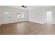 Bright living area with a large window and sleek floors, leading to a bathroom at 704 East St, Smithfield, NC 27577