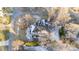 Aerial view of brick home with partial snow-covered roof and bare trees at 101 Mantle Dr, Clayton, NC 27527