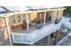Aerial view of a large brick house with a spacious deck, perfect for outdoor entertaining at 101 Mantle Dr, Clayton, NC 27527
