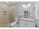 Updated bathroom features tile shower with niche, updated vanity and fixtures, and neutral walls and tile at 101 Mantle Dr, Clayton, NC 27527