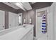 Neutral bathroom featuring a shower/tub combo and large vanity mirror at 101 Mantle Dr, Clayton, NC 27527