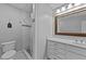 Cozy bathroom boasts a tiled shower and a vanity with drawers and a large mirror at 101 Mantle Dr, Clayton, NC 27527